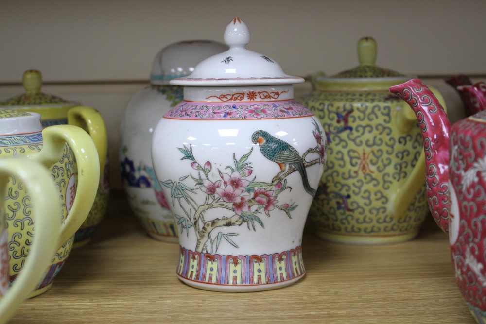 Three Chinese blue and white prunus pattern ginger jars, two other jars and ten assorted teapots